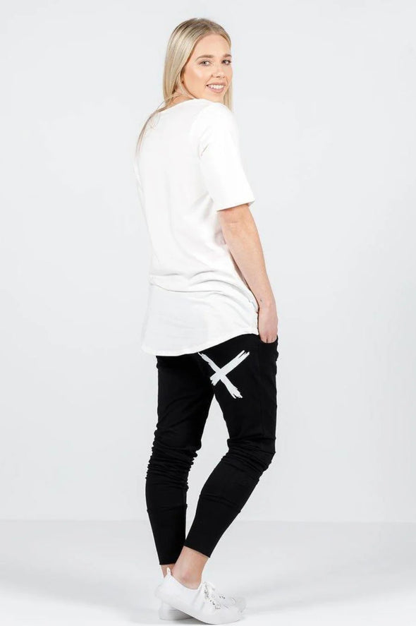 Apartment pants with a single white cross